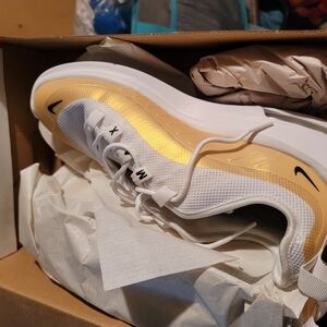 Nike Gold and White Athletic Shoes Sleek Design